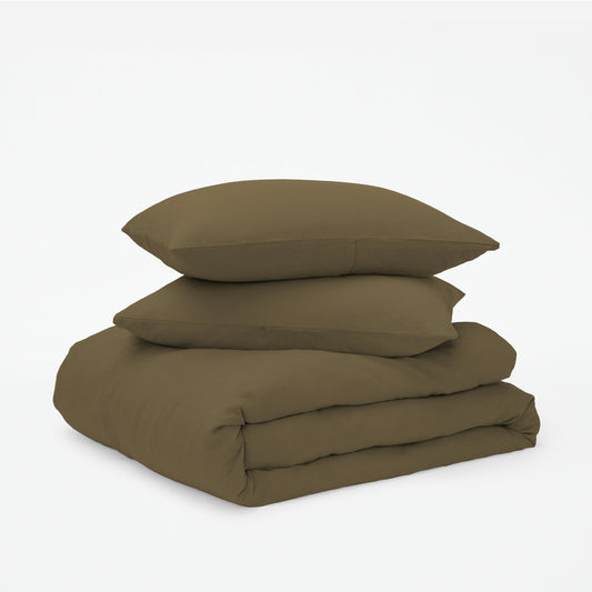 The Tuft and Needle Linen-Cotton Blend Duvet Set, 2 pillows stacked on 1 duvet covered blanket || color: Martini Olive
